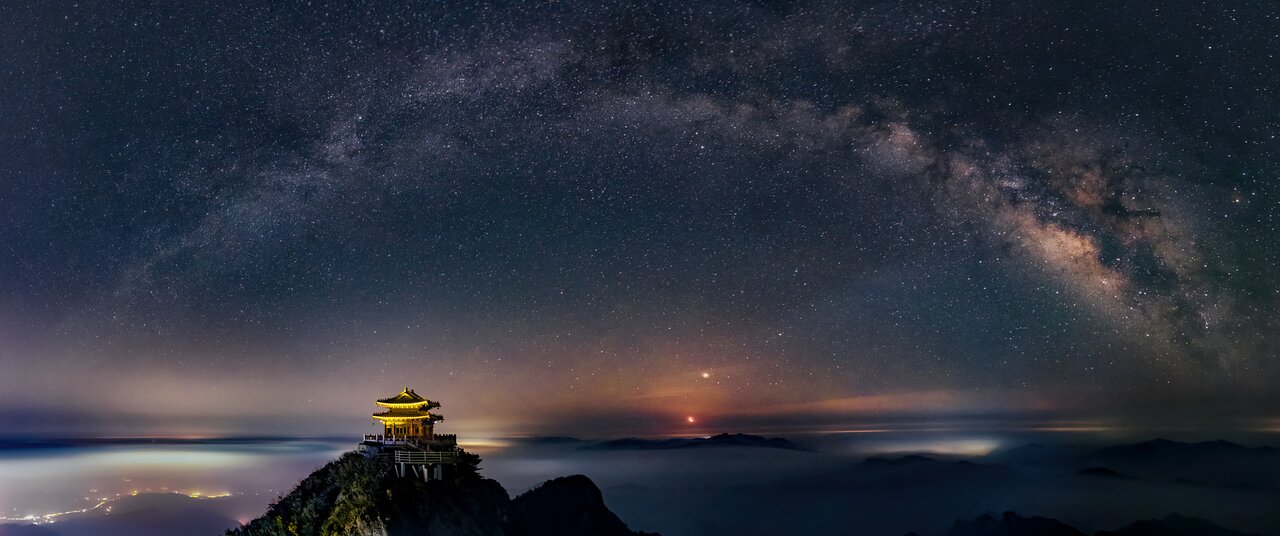 The Moon and Milky Way Arch Above the Golden Hall